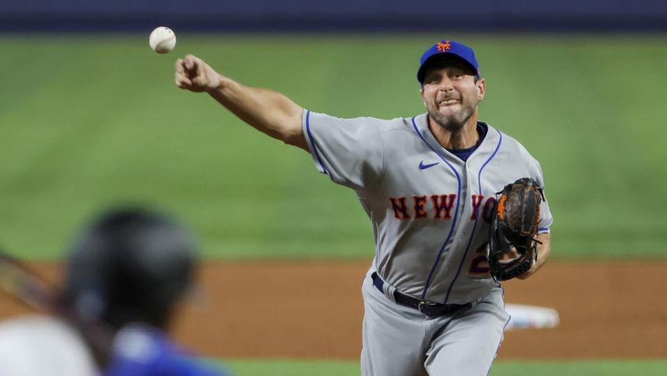 / Mar 30, 2023; Miami, Florida, USA; New York Mets starting pitcher Max Scherzer (21) delivers a pitch during the fifth inning against the Miami Marlins at loanDepot Park.