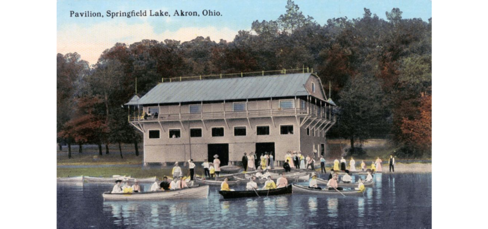 Boaters enjoy a beautiful day in front of the pavilion at Springfield Lake Park in the early 20th century.