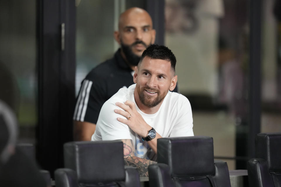 Inter Miami forward Lionel Messi watches from his box on the sideline at the start of an MLS soccer match between Inter Miami and Charlotte FC, Wednesday, Oct. 18, 2023, in Fort Lauderdale, Fla. (AP Photo/Rebecca Blackwell)