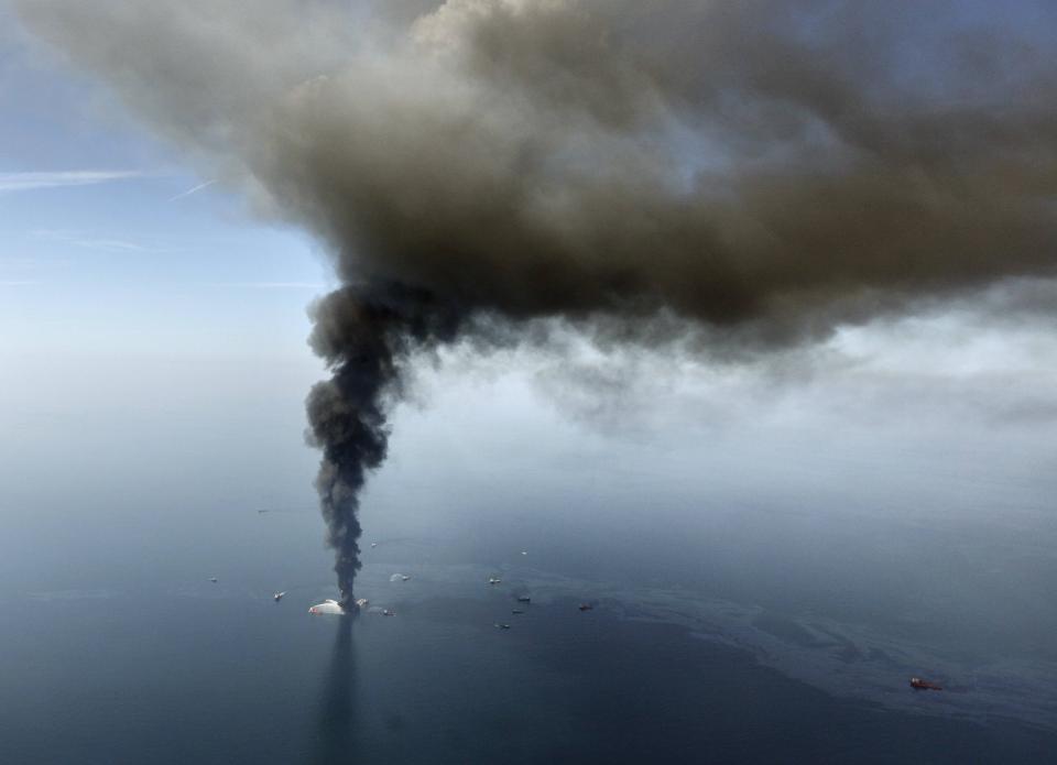 FILE - The Deepwater Horizon oil rig burns in the Gulf of Mexico on April 21, 2010. (AP Photo/Gerald Herbert, File)