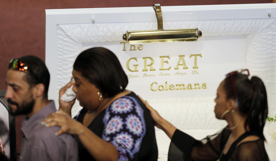 Guest arrive for the showing of Glenn Coleman, Reece Coleman, Evan Coleman and Arya Coleman, Friday, July 27, 2018, in Indianapolis. Nine members of the Coleman family were killed after a duck boat capsized and sank during a storm in Branson, Mo. (AP Photo/Darron Cummings)