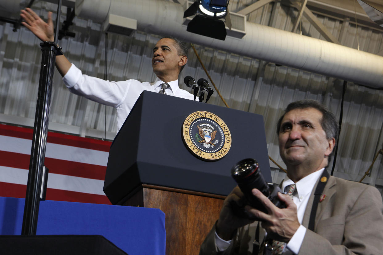 Former White House photographer Pete&nbsp;Souza, seen standing in front of President Barack Obama in 2012, is releasing a new photo book.