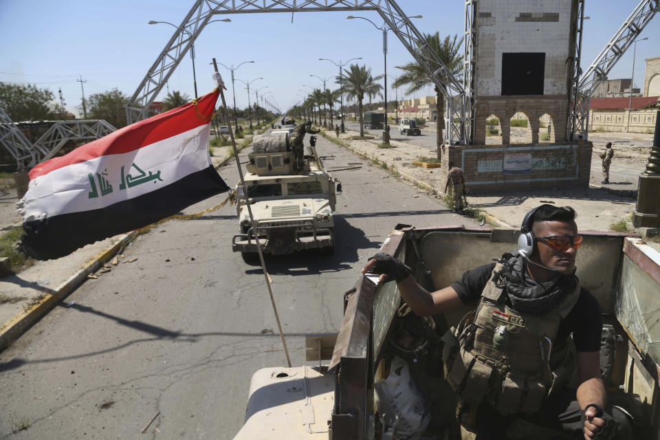 In this Thursday, April 2, 2015 file photo, Iraqi security forces deploy in Tikrit, 80 miles  north of Baghdad, Iraq, a day after Iraqi security forces backed by Shiite militiamen took control of the city from Islamic State militants. (AP Photo/Khalid Mohammed, File)