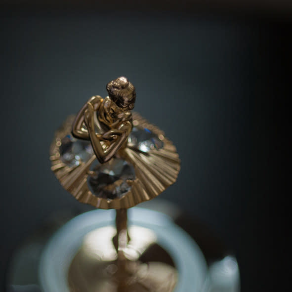 Close-up of a ballerina figure on a music box