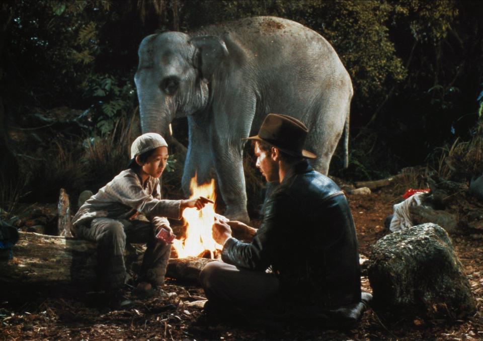 Ke Huy Quan with Harrison Ford in a scene from 1984's Indiana Jones and the Temple of Doom. (Alamy)