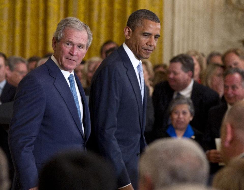 President Barack Obama and former President George W. Bush walk from the stage in the East Room of the White House in Washington, Thursday, May 31, 2012, after unveiling of the Bush portrait. (AP Photo/Carolyn Kaster)