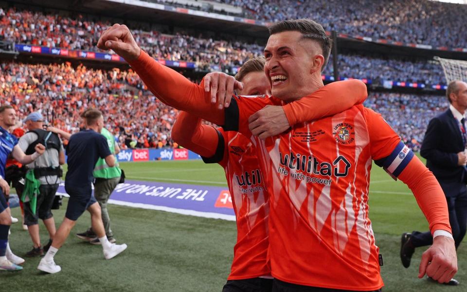 Luton Town's English defender Dan Potts celebrates - AFP/Adrian Dennis