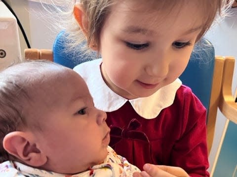 Bathsheba Fenyrch-Velez with her newborn sister, Dorothea