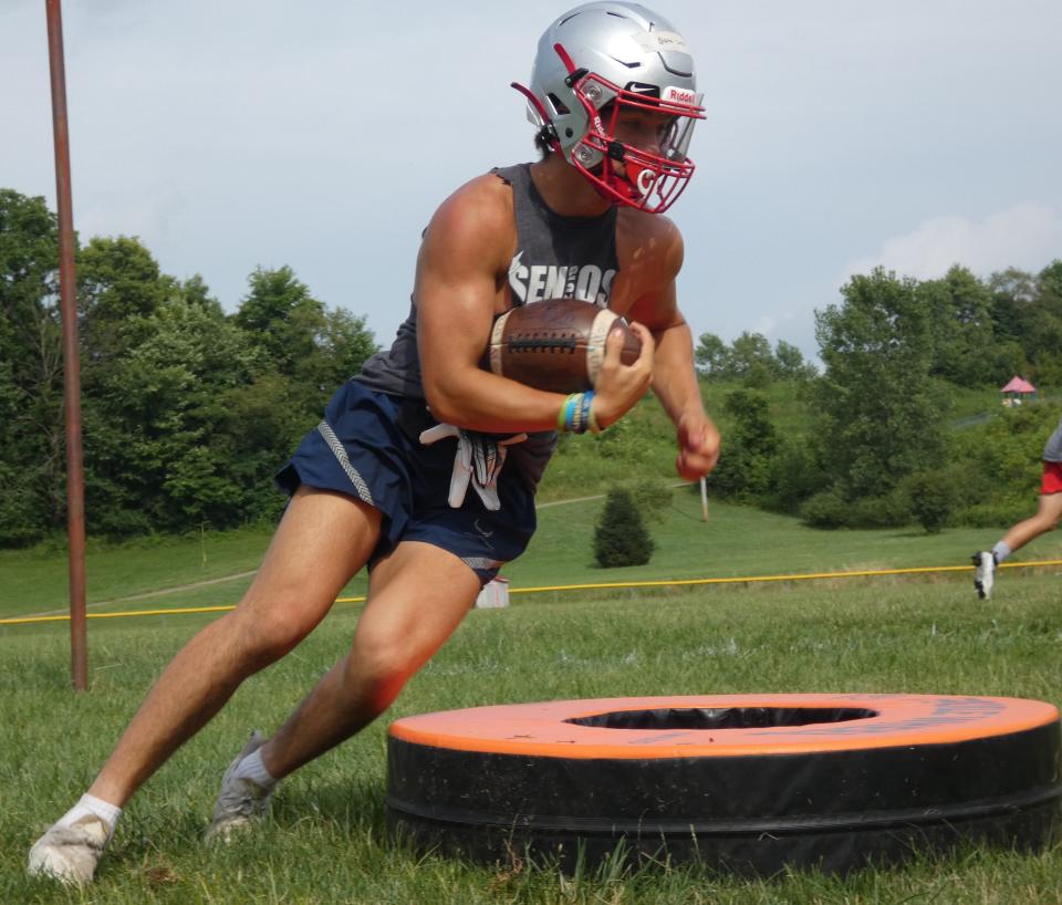 Utica junior Justin Giffin cuts around a tire during a July camp day. Giffin will pair with classmate Tyler Collura at running back this season.