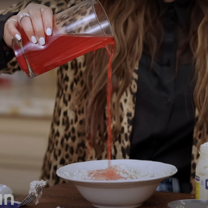 Adrienne pouring fruit punch on her tuna