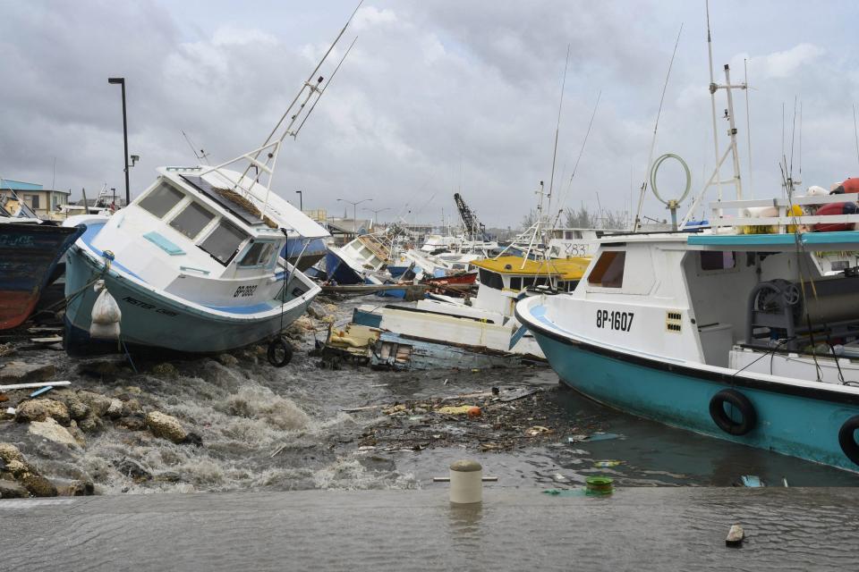 Damaged fishing boats rest on the shore after the passing of Hurricane Beryl at the Bridgetown Fish Market, Bridgetown, Barbados on July 1, 2024. (Photo by Randy Brooks / AFP) (Photo by RANDY BROOKS/AFP via Getty Images)