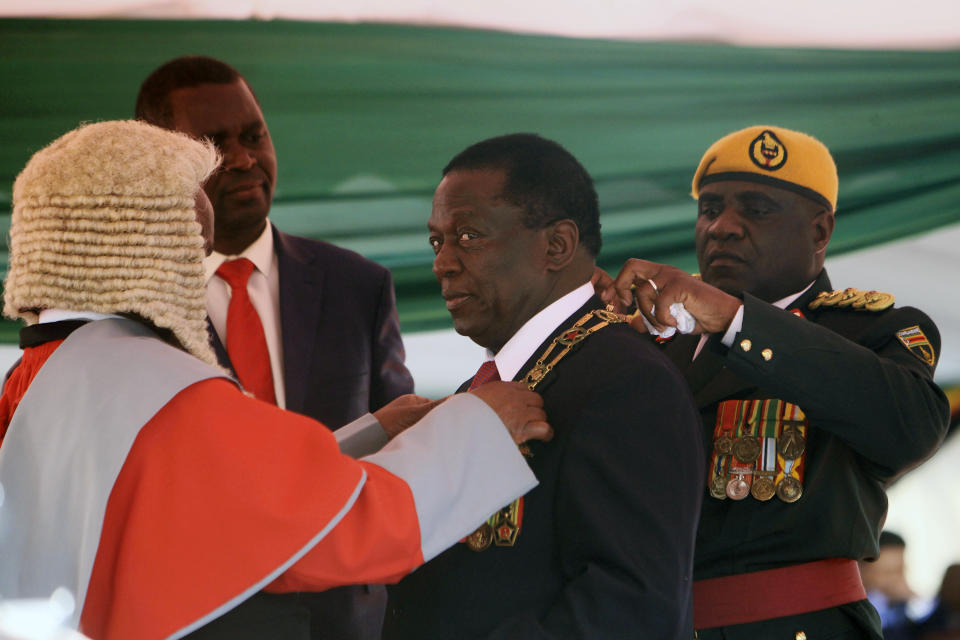 Zimbabwean President Emmerson Mnangagwa during his inauguration ceremony at the National Sports Stadium in Harare, Sunday, Aug. 26, 2018. The Constitutional Court upheld Mnangagwa's narrow election win Friday, saying the opposition did not provide " sufficient and credible evidence" to back vote- rigging claims.(AP Photo/Tsvangirayi Mukwazhi)