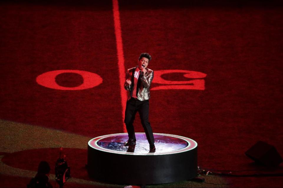 Bruno Mars performs during the halftime show of the NFL Super Bowl XLVIII football game Sunday, Feb. 2, 2014, in East Rutherford, N.J. (AP Photo/Charlie Riedel)