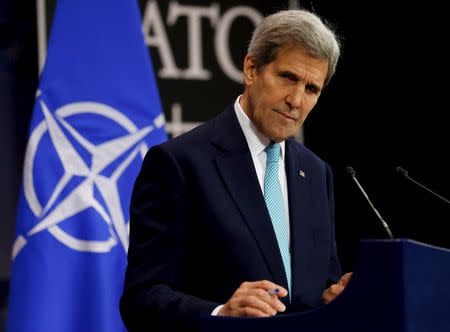 U.S. Secretary of State John Kerry listens to a question during a news conference at the NATO ministerial meetings at NATO Headquarters in Brussels December 2, 2015. REUTERS/Jonathan Ernst