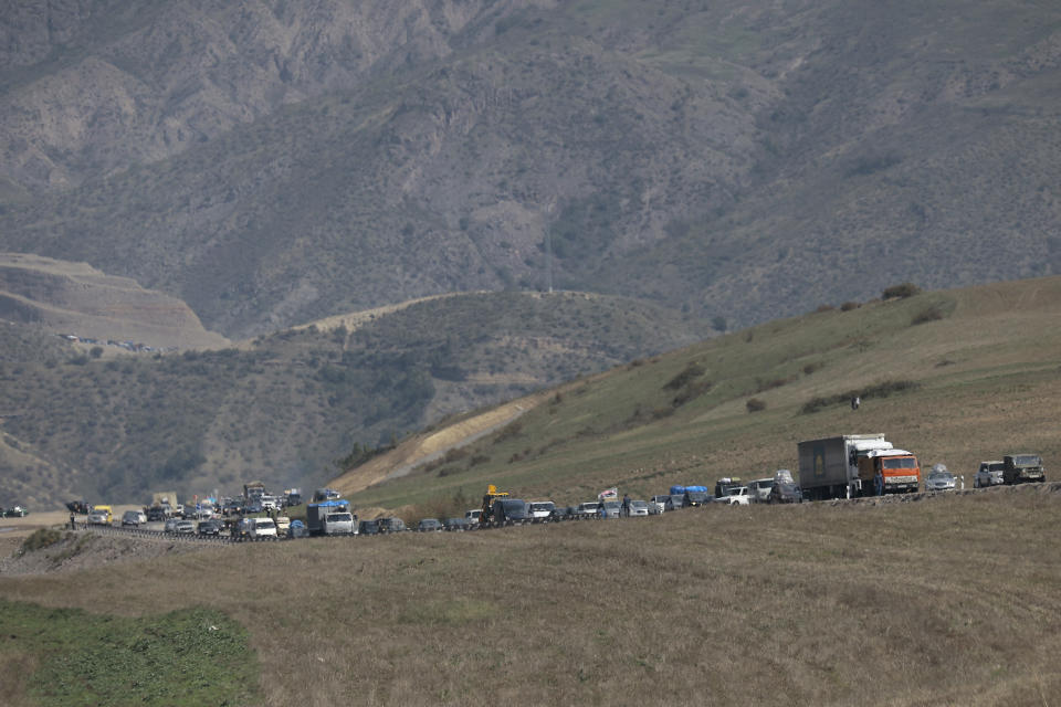 Ethnic Armenians from Nagorno-Karabakh drive their cars on the road from Nagorno-Karabakh to Armenia's Goris in Syunik region, Armenia, Friday, Sept. 29, 2023. Armenian officials say more than 70% of Nagorno-Karabakh's original population have fled the region for Armenia. (AP Photo/Vasily Krestyaninov)