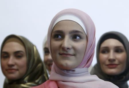 Aishat Kadyrova (front), head of the Firdaws fashion house and daughter of the Chechen Republic leader Ramzan Kadyrov, attends the Mercedes-Benz Fashion Week Russia in Moscow, Russia, March 17, 2017. REUTERS/Sergei Karpukhin