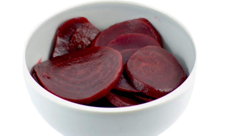 white bowl with sliced beets