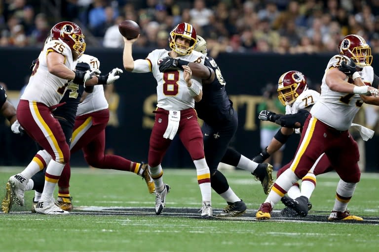 Kirk Cousins of the Washington Redskins is sacked by David Onyemata of the New Orleans Saints during the first half at the Mercedes-Benz Superdome