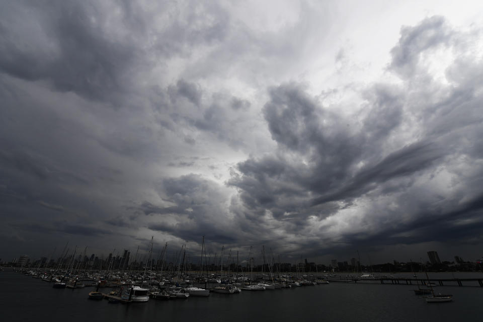 Storm clouds, seen from St Kilda pier, form over Melbourne.