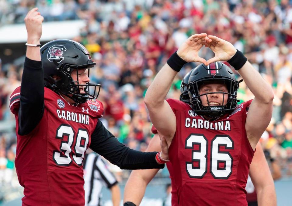 South Carolina Gamecocks long snapper Hunter Rogers (36) celebrates his touchdown from Kai Kroeger (39) against Notre Dame during the Gator Bowl at TIAA Bank Field in Jacksonville, FL on Friday, Dec. 30, 2022. Sam Wolfe/Special To The State