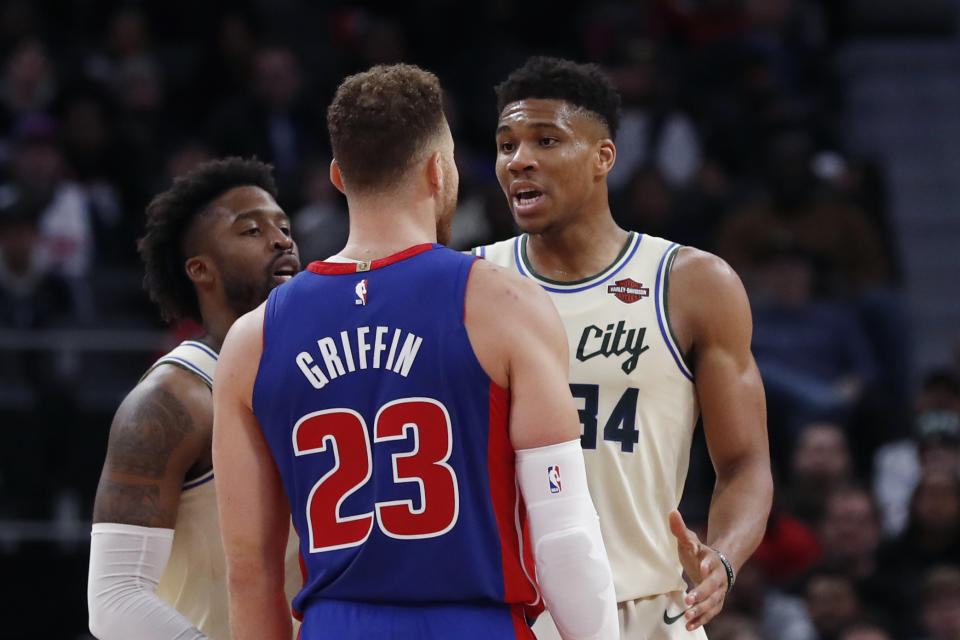 Detroit Pistons forward Blake Griffin (23) and Milwaukee Bucks forward Giannis Antetokounmpo (34) exchange words after a foul on the floor during the first half of an NBA basketball game, Wednesday, Dec. 4, 2019, in Detroit. (AP Photo/Carlos Osorio)