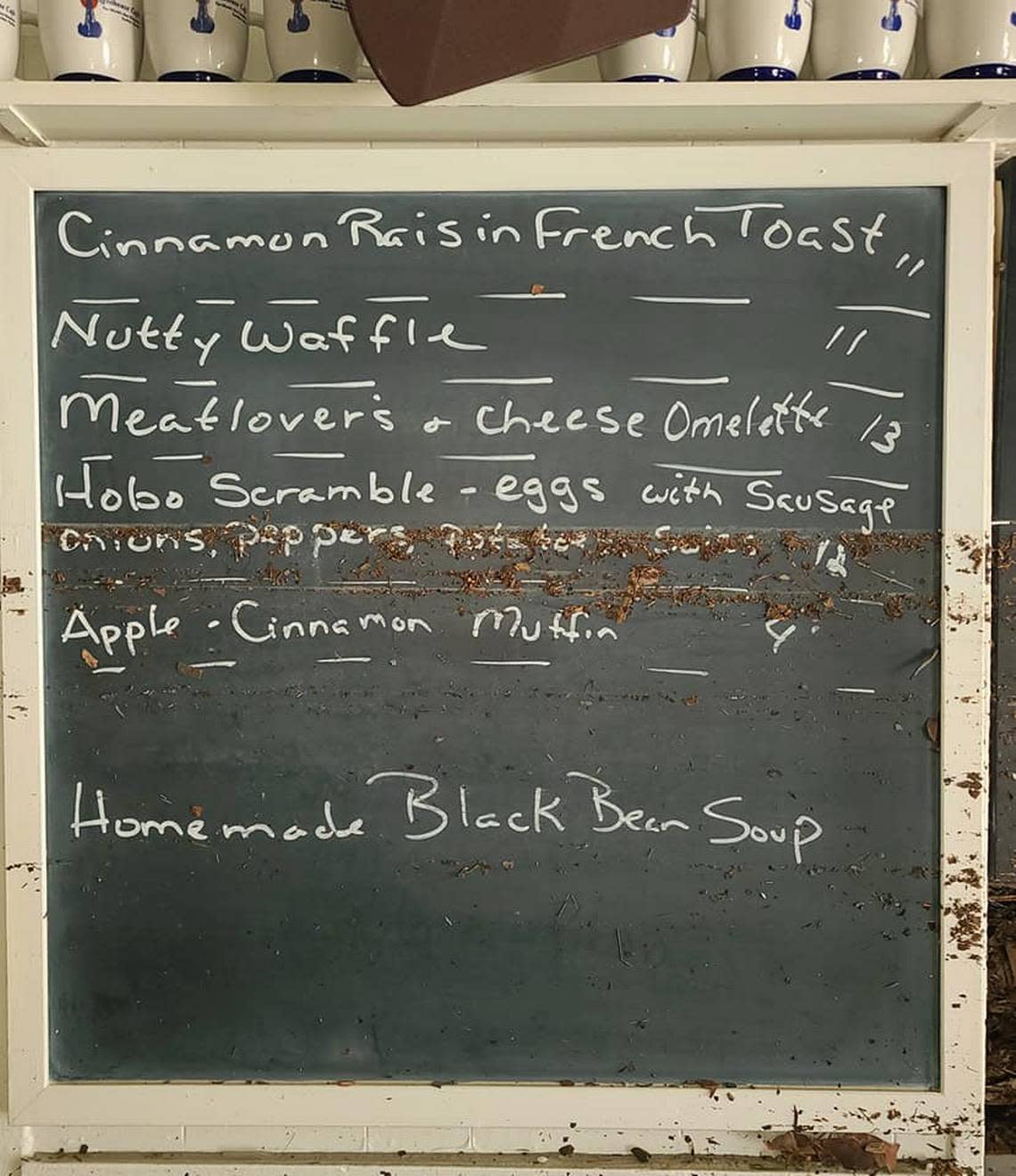 The storm surge water line obscures part of the chalkboard menu offerings in this post-Hurricane Ian image from Lighthouse Café owner Dan Billheimer’s Facebook post on Oct. 6, 2022.