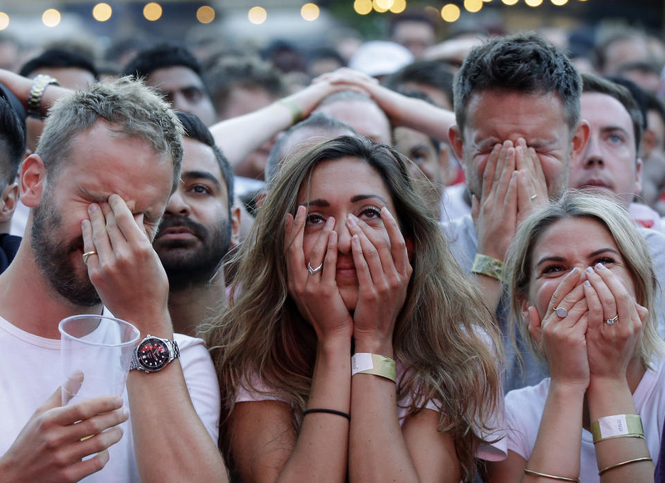 FILE - In this July 11, 2018 file photo England soccer fans react after Croatia scored their side's first goal as they watch a live broadcast on a big screen of the semifinal match between Croatia and England at the 2018 soccer World Cup, in Flat Iron Square, south London. (AP Photo/Luca Bruno, File)