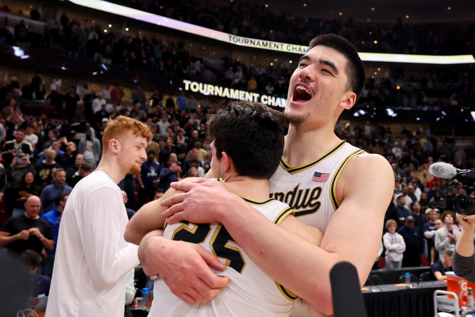 Zach Edey of the Purdue Boilermakers celebrates with Ethan Morton after defeating Penn State to win the Big Ten tournament. (Photo by Michael Reaves/Getty Images)