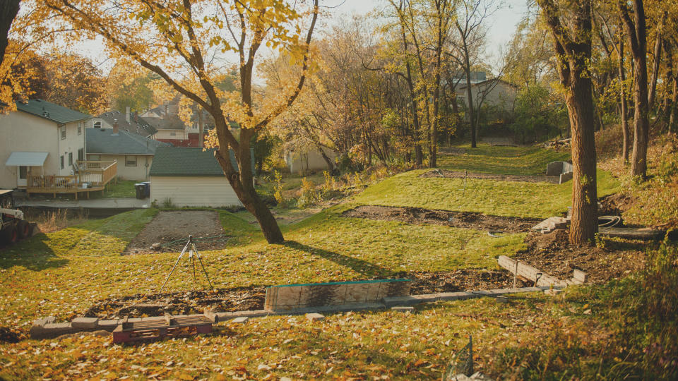 This photo provided by Settled and the Mosaic Christian Community shows church land prepared for six tiny homes in St. Paul, Minn., in the fall of 2021. “We do not have a lot of property,” said Jeff O’Rourke, lead pastor of Mosaic Christian Community in St. Paul. “We have just strived to use every square inch of property that we have to be hospitable.” (John Swee/Dodge Creative Photography/Settled/Mosaic Christian Community via AP)