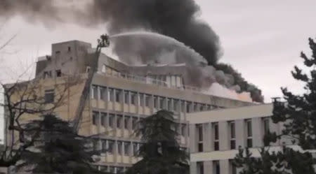 Firefighters extinguish the fire that broke out on the rooftop of Lyon university, in Lyon, France January 17, 2019, in this still image obtained from a social media video. Twitter/ @PODEUS69 via REUTERS