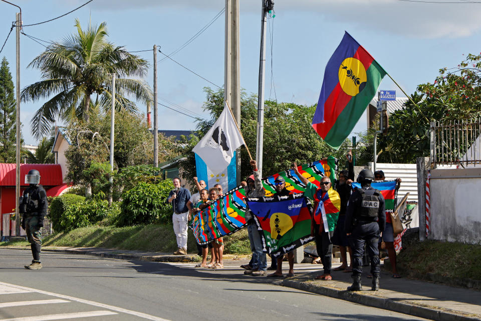 People demonstrate as French President Emmanuel Macron's motorcade drives past in Noumea, in France's Pacific territory of New Caledonia, May 23, 2024. / Credit: LUDOVIC MARIN/Pool/REUTERS
