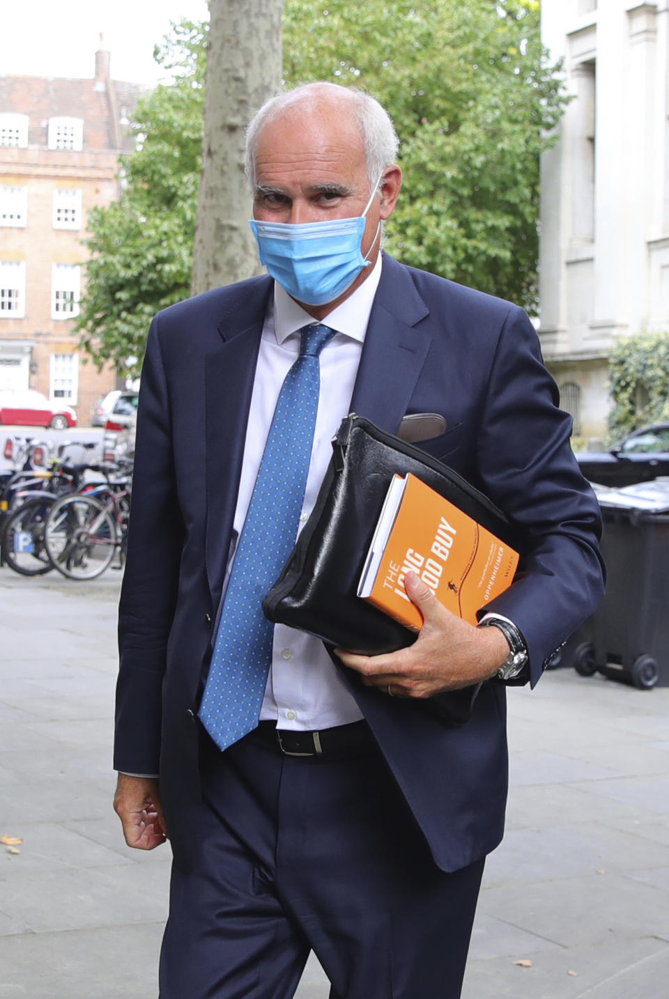 EU Ambassador to the UK, Portuguese diplomat Joao Vale de Almeida, left, arrives at Europe House in Westminster, London, Tuesday, Sept. 8, 2020. The U.K.’s chief negotiator in post-Brexit trade talks called for “more realism” from the European Union before the start Tuesday of another round of discussions between the two sides. (Aaron Chown/PA via AP)