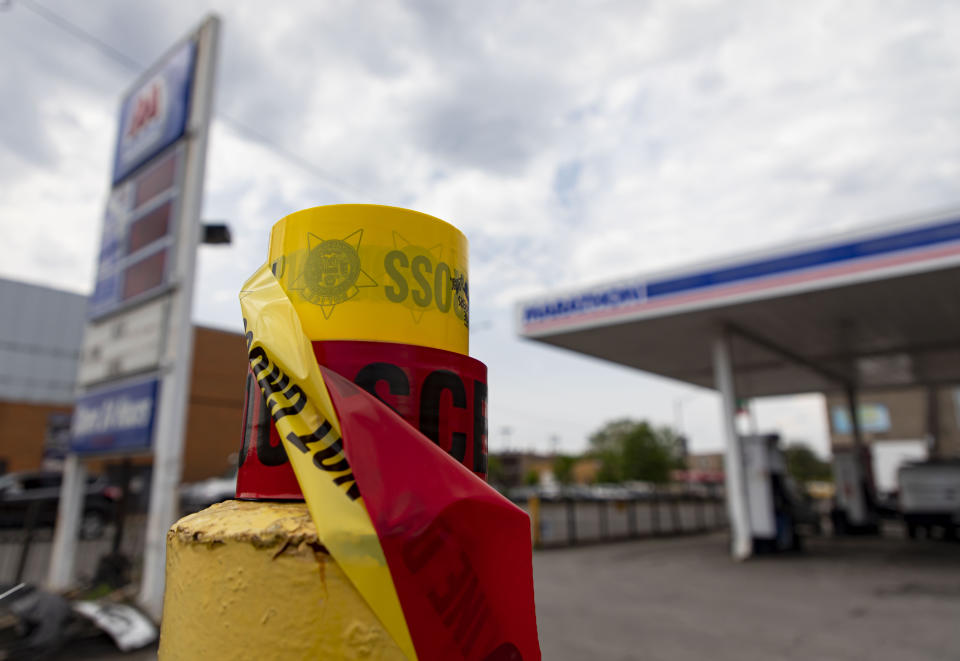 Crime scene tape is left at a gas station in the 800 block of North Cicero Avenue on Thursday, May 19, 2022 where Chicago police shot a 13-year-old carjacking suspect Wednesday night. The Civilian Office of Police Accountability (COPA), the agency that investigates officer-involved shootings, said the shooting happened Wednesday night on the city's far West Side after officers spotted a vehicle matching the description of one used in a carjacking in the suburb of Oak Park. (Brian Cassella/Chicago Tribune via AP)