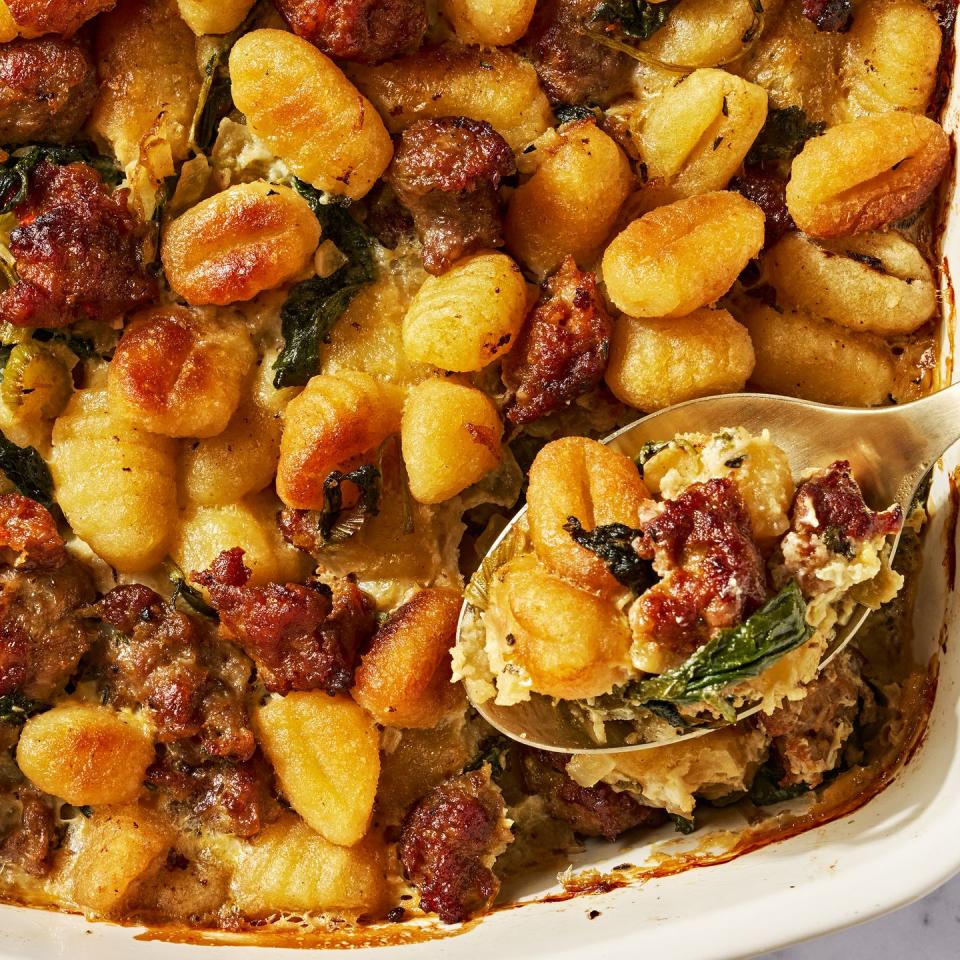 gnocchi and sausage stuffing in a white baking dish