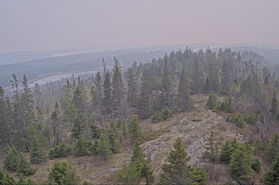 A forest cam image of Isle Royale, Michigan on 12 May 2024. Thousands of residents are facing air quality alerts as wildfire smoke blows in from Canada (US National Park Service)