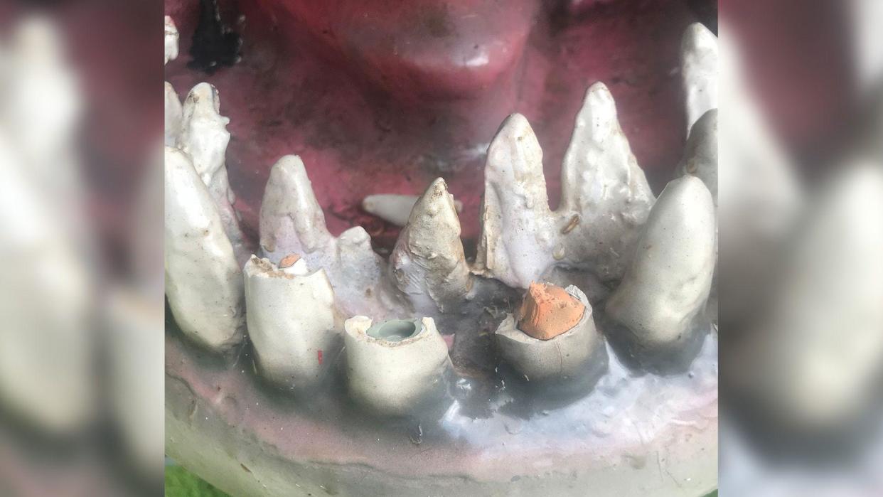 Broken teeth in the mouth of a speedboat that had been built to look like a great white shark