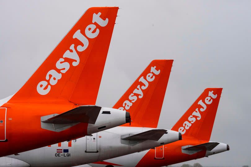 In this file photo taken on October 31, 2020 aircrafts of British low-cost carrier Easyjet are parked at Berlin's new Berlin - Brandenburg Airport (BER) in Schoenefeld