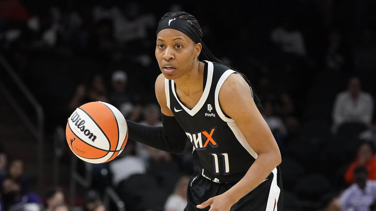 Phoenix Mercury's Shey Peddy (11) dribbles up court during a WNBA basketball game against the Las Vegas Aces, Friday, May 6, 2022, in Phoenix. (AP Photo/Darryl Webb)