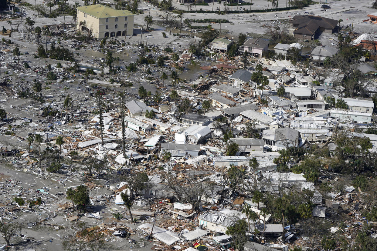 An aerial view of damaged homes and debris in the aftermath of Hurricane Ian.