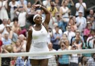 Serena Williams of the U.S.A. celebrates after winning her match against Timea Babos of Hungary at the Wimbledon Tennis Championships in London, July 1, 2015. REUTERS/Toby Melville