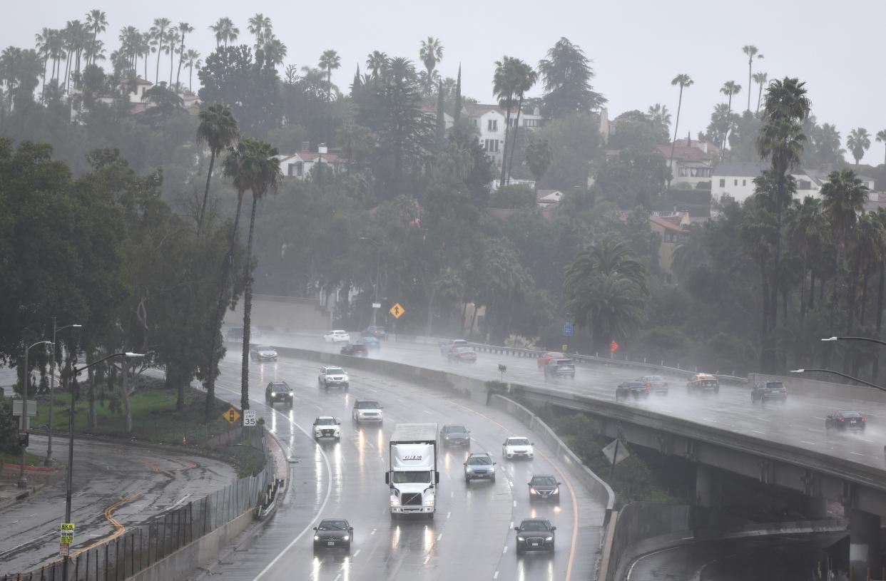 Cars drive through torrential rain on US-101 in Los Angeles on 19 February 2024 (Getty Images)