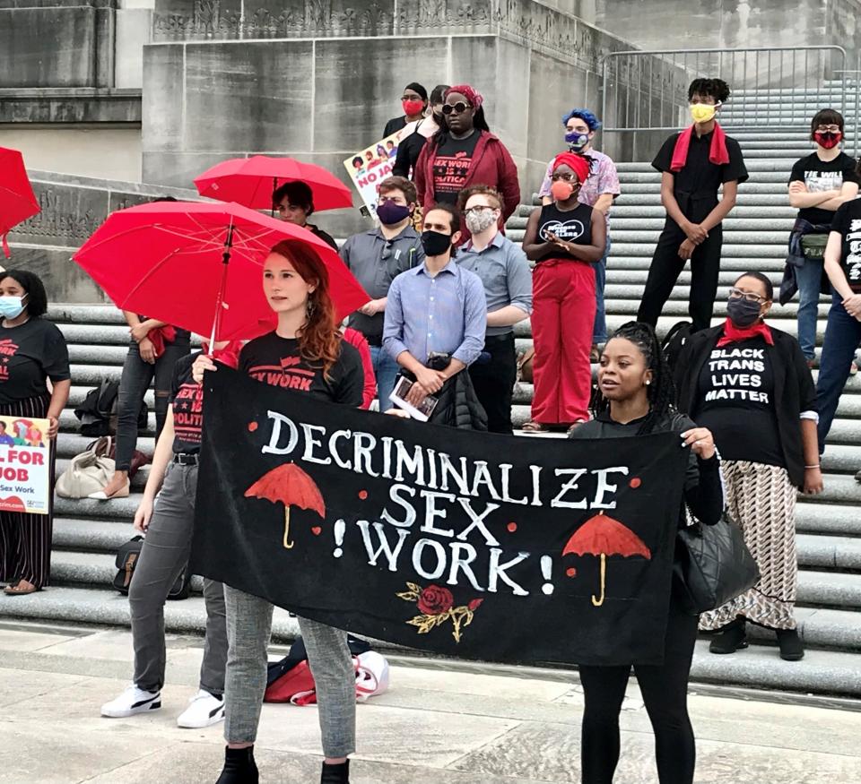 Supporters of a bill to decriminalize adult consensual sex work in Louisiana rally on the steps of the state capitol on May 4, 2021.