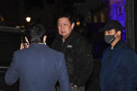 Kyaw Zwar Minn, center, the Myanmar ambassador, talks with his staff outside the Myanmar Embassy in London, Wednesday, April 7, 2021. Newspaper reports say the embassy was taken over by members of the country's new military regime Wednesday evening. (AP Photo/Alberto Pezzali)