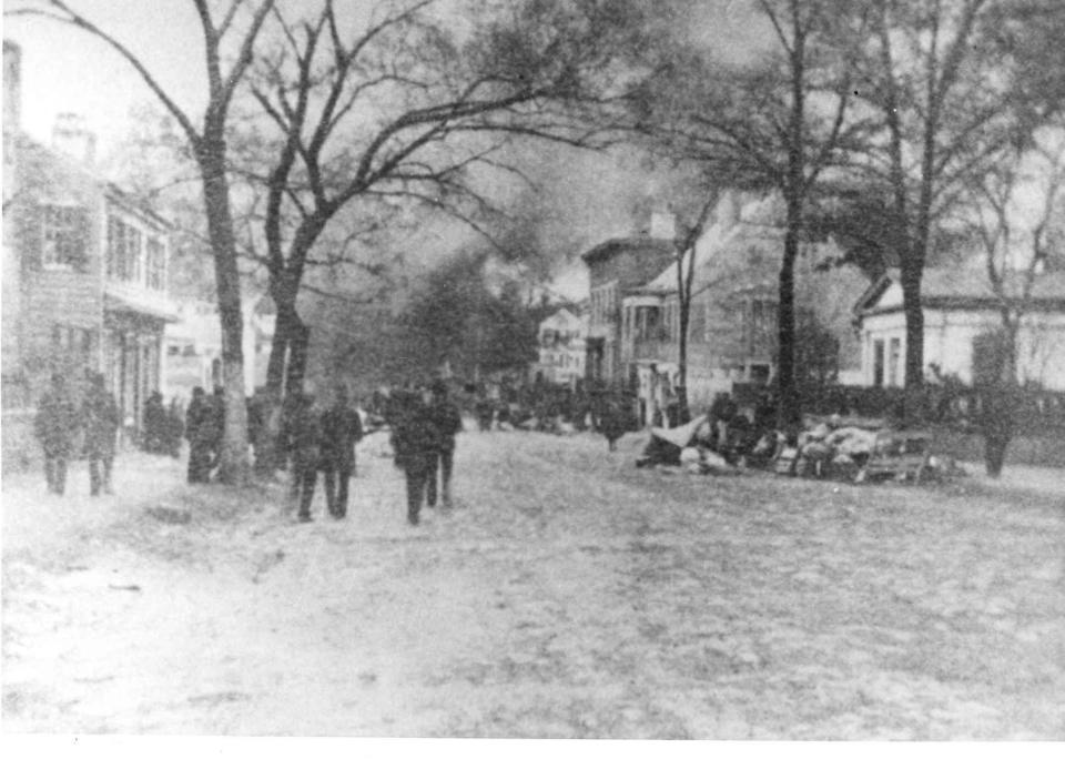 Street scene during the fire of 1886 in Wilmington. A label on the back of the photo reads "The largest fire in the history of Wilmington, N.C., Sunday, February 21, 1886."