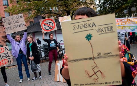 People demonstrate against Sweden Democrats and its party leader Jimmie Akesson - Credit: JONATHAN NACKSTRAND/AFP