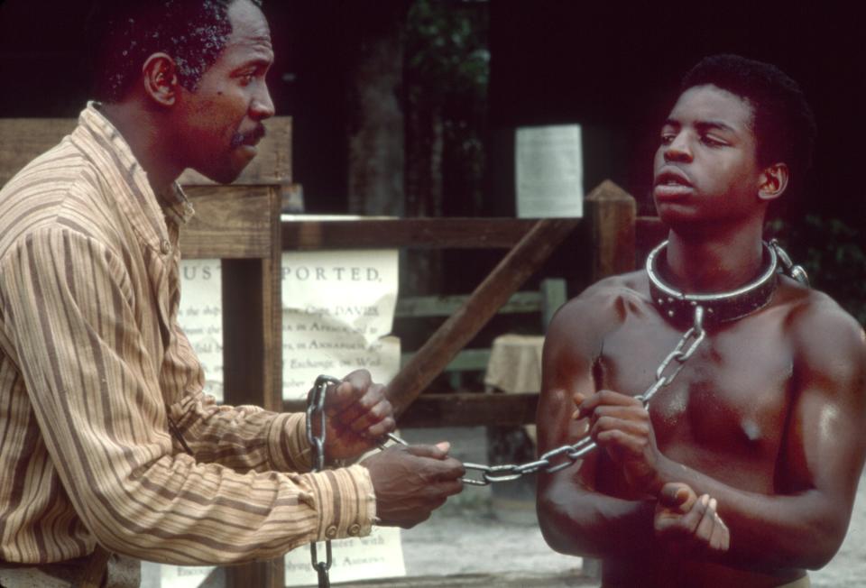 Louis Gossett Jr., left, and LeVar Burton in ‘Roots’ - Credit: Everett Collection