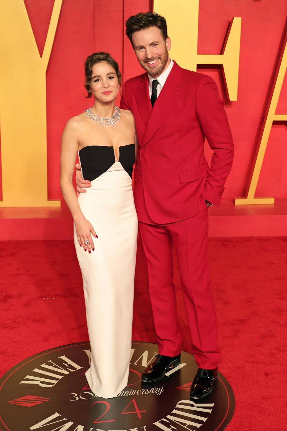 Alba Baptista and Chris Evans attend the 2024 Vanity Fair Oscar Party on March 10, 2024.