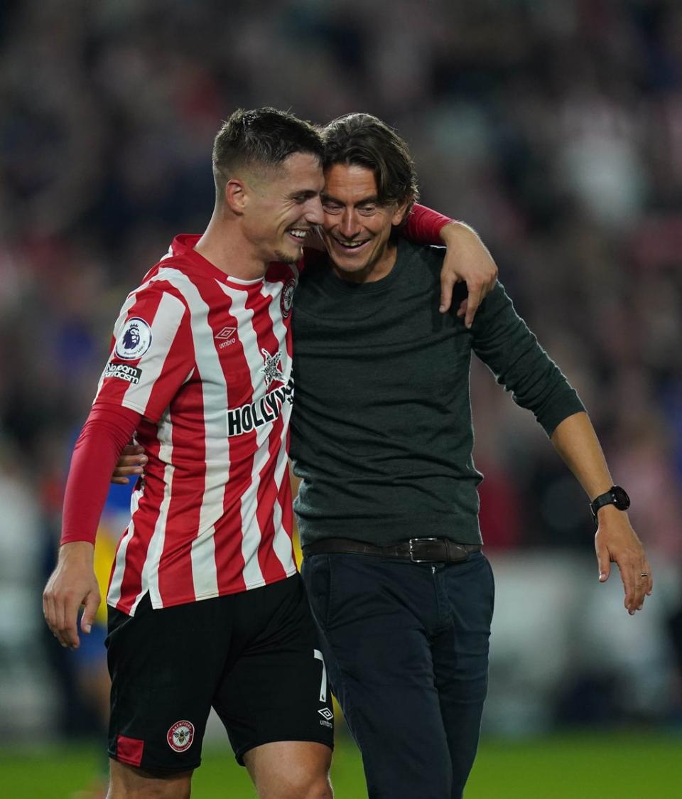 Brentford’s Sergi Canos and manager Thomas Frank celebrate their 3-3 draw with Liverpool (Adam Davy/PA) (PA Wire)