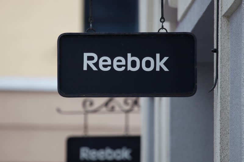 Boards with Reebok store logo are seen on a shopping center at the outlet village Belaya Dacha outside Moscow