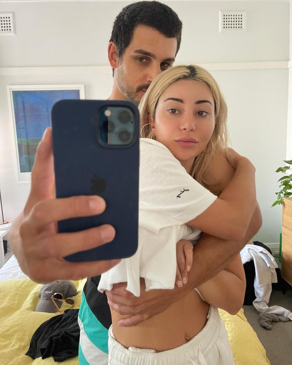 Martha Kalifatidis and partner Michael Brunelli pose for a selfie together in their bedroom